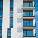 Low-angle photo of gray concrete building