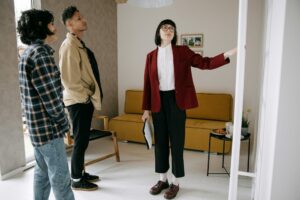 Real estate agent showing a house to a couple